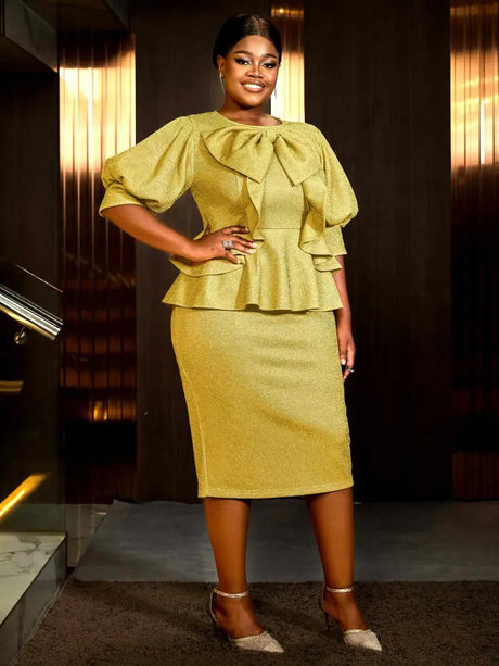 This elegant gold dress is perfect for spring dresses for wedding and ideal for trendy plus size dresses for wedding guest who love ruffles and bows

