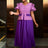 Elegant pleated dress wedding guest style perfect as church clothes for women with ruffle sleeves and colorblock design for a flattering look.








