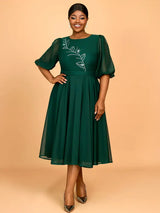 Ideal for plus size wedding guest dresses plus size prom dresses and chic birthday outfits with its flattering A line cut and elegant rhinestone details

