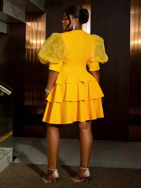 Charming yellow wedding guest dress with puff sleeves and A Line silhouette perfect for summer parties and elegant A Line wedding guest dresses look

